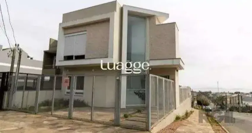 Casa com 3 quartos à venda na Rua Henrique Anawate, 584, Guarujá, Porto Alegre