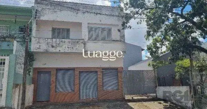 Casa /Sobrado  com apartamento e loja, estacionamento, a venda no Bairro Jardim Itu.  Lojão embaixo com dois banheiros e divisórias,
