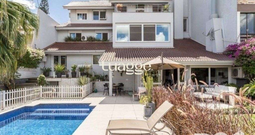 EXCLUSIVIDADE: Ampla casa de 476m² privativos, 4 suítes, 4 vagas no bairro Chácara das Pedras.