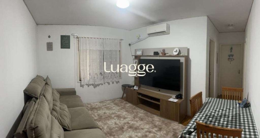 Apartamento de 2 dormitórios, living, cozinha, área de serviço e banheiro social.