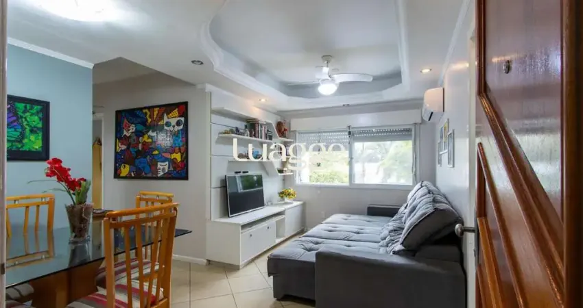 Apartamento de 2 quartos, living, cozinha planejada, área de serviço e 1 vaga.