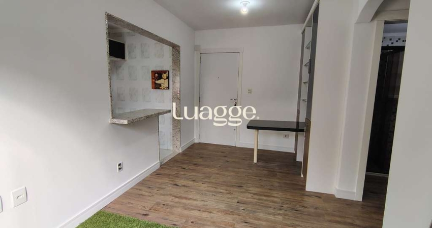 Apartamento de 1 dormitório, living, cozinha planejada, banheiro social.