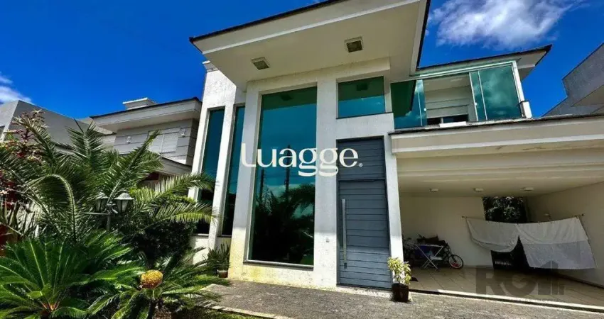 CASA EM CONDOMINIO COM TRES DORMITÓRIOS TRES SUITES