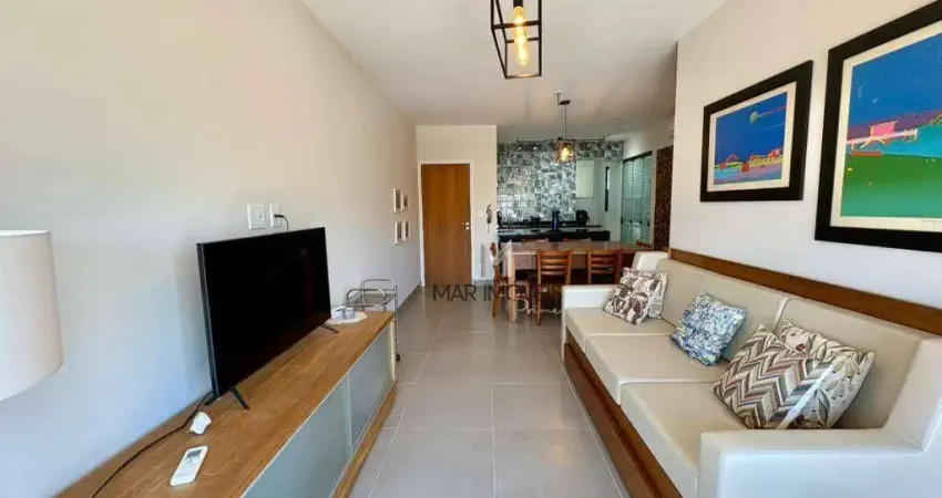 Apartamento totalmente reformado á venda na praia da enseada /mar imóveis prime.