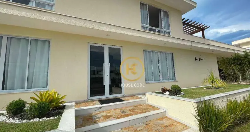 Casa com 4 dormitórios à venda, 518 m² por R$ 3.500.000,00 - Condomínio Flora Rica - Peruíbe/SP
