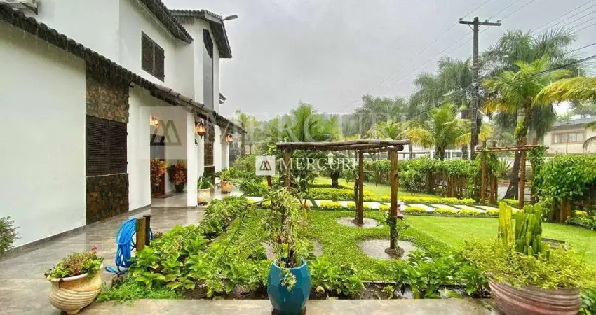 Casa no guarujá, jardim pernambuco, condomínio fechado, 5 quartos, sendo 3 suítes, piscina e churrasqueira - mercuri imóveis - imobiliária no guarujá