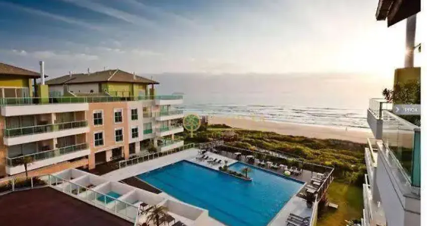 Frente mar à venda na praia do santinho! sacada com jacuzzi, semi mobiliado, 2 quartos e 1 vaga de garagem.