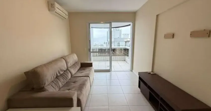 À venda | 73 m², sacada com churrasqueira, semi mobiliado, 2 quartos e 1 vaga de garagem - Itacorubi, em Florianópolis.