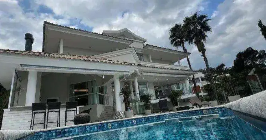 Mansão com 5 suítes à venda em florianópolis/sc, condomínio fechado, 991 m², elevador, piscina e 4 vagas - bairro cacupé.