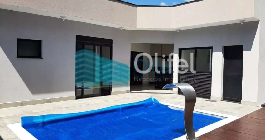 Linda casa térrea, 206m².O imóvel conta com 03 suítes com armários, sendo a suíte master com closet, escritório, lavabo, sala 2 ambientes, cozinha com armários e espaço gourmet com churrasqueira e arm