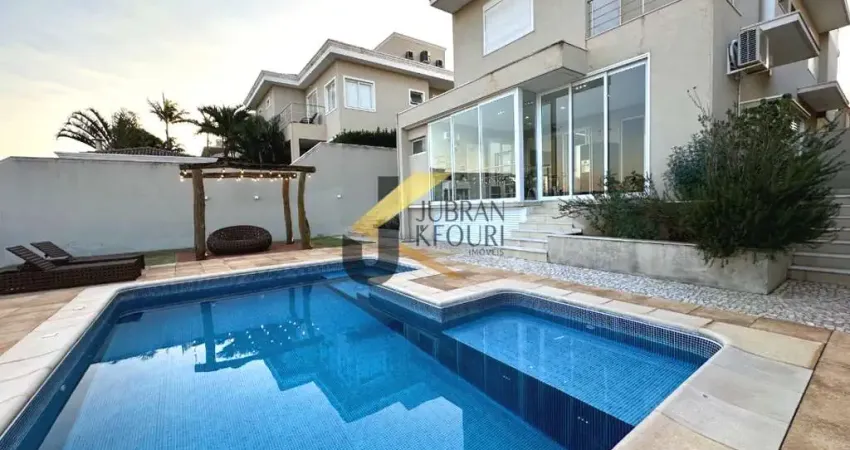 Casa à venda no Alphaville Dom Pedro - Campinas, com 3 suítes, lazer privativo com piscina e garagem para 4 carros.
