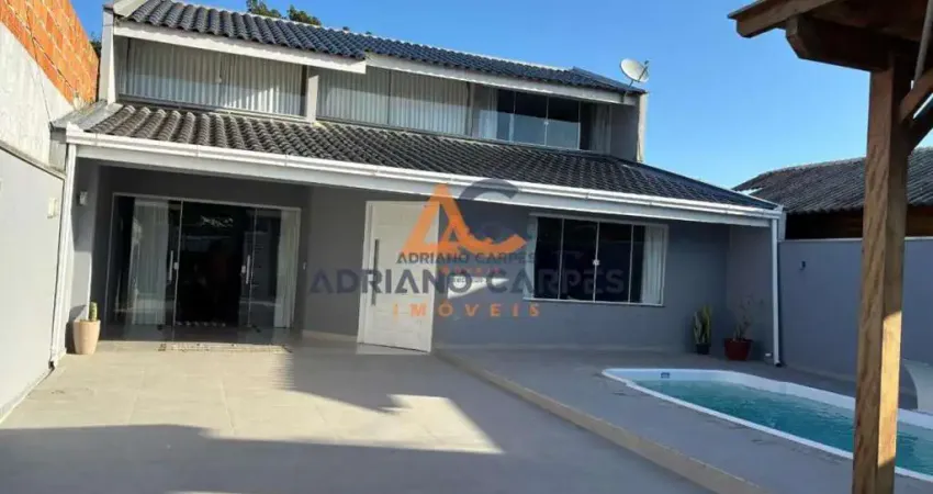 Casa de alto padrão com 4 dormitórios sendo 3 suítes e banheiro social, no bairro meia praia, em navegantes - adriano carpes imóveis vende