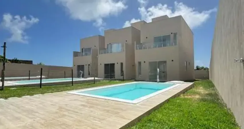 Residencial exclusivo em condomínio fechado lado praia-barra do jacuípe. 3/4 sendo 2 suítes. piscina e garagem.