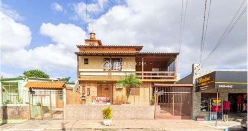 Casa com 4 quartos à venda na Juscelino Kubitschek de Oliveira, 579, Parque Granja Esperança, Cachoeirinha