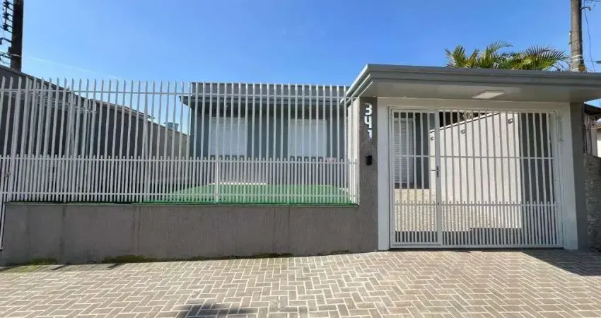Casa com 3 dormitórios, 200 m² - venda por R$ 790.000,00 ou aluguel por R$ 5.990,00/mês - Nova Estância - Estância Velha/RS
