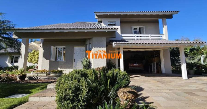 Casa à venda com 4 dormitórios, piscina, área gourmet, maravilhoso jardim no Bairro Ideal em Novo Hamburgo.