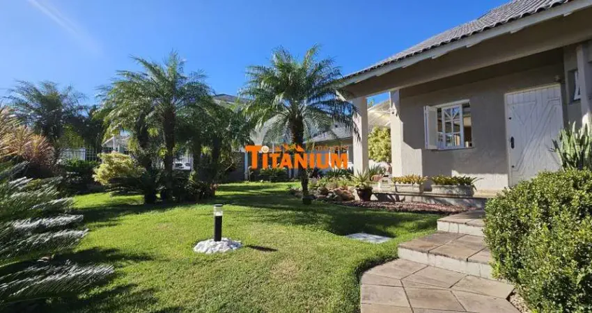 Casa à venda com 4 dormitórios, piscina, área gourmet, maravilhoso jardim no bairro ideal em novo hamburgo.