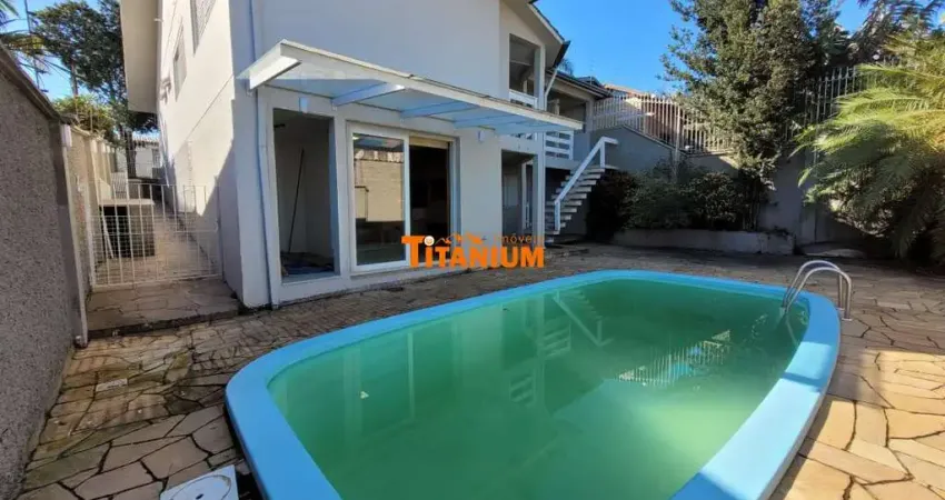 Casa à venda em petrópolis, novo hamburgo - 3 dormitórios sendo 1 suíte. churrasqueira, piscina e garagem coberta