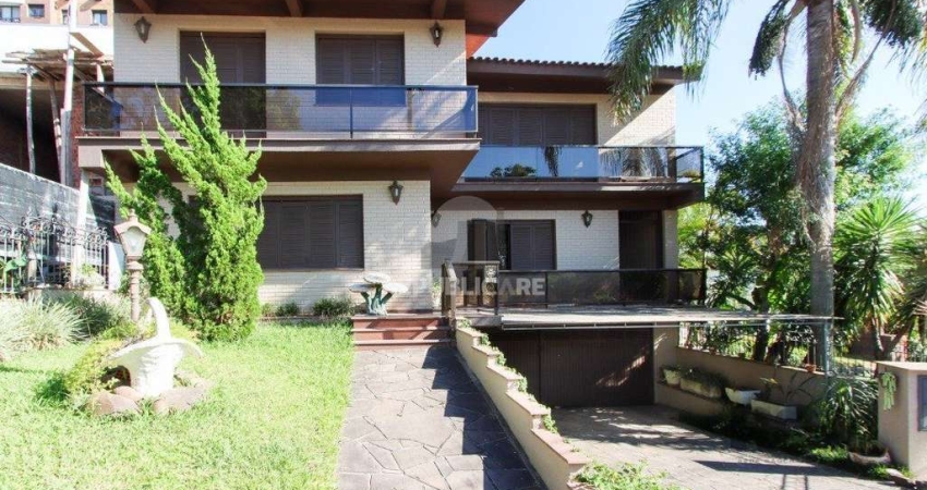 Casa a venda com 03 dormitórios, living 03 ambientes com vista para o Rio.