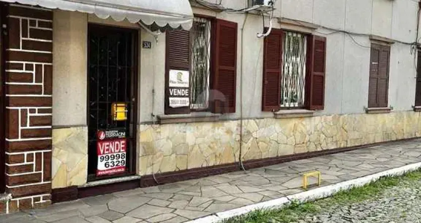 Vende-se apto térreo, com 03 dormitórios, sala com 02 ambientes