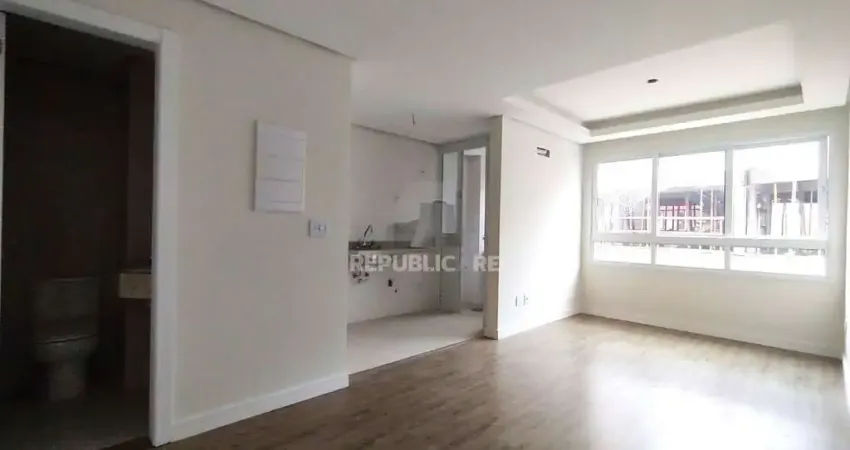 APARTAMENTO 1 DORMITÓRIO COM SUÍTE, COZINHA AMERICANA, LAVABO E AMPLO LIVING NO