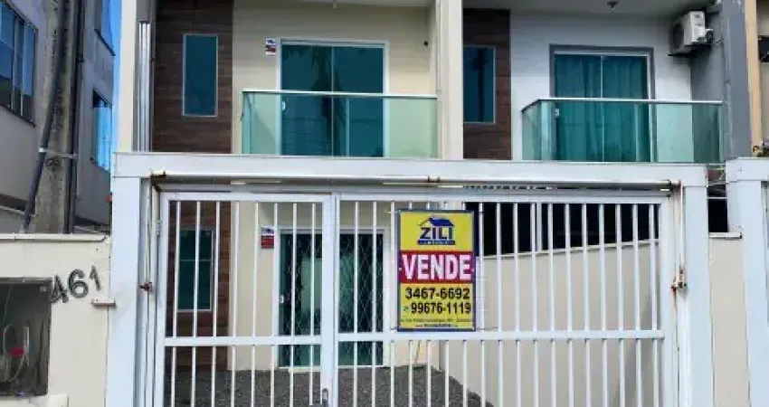 Lindo sobrado geminado com 2 quartos sendo duas suítes no aventureiro