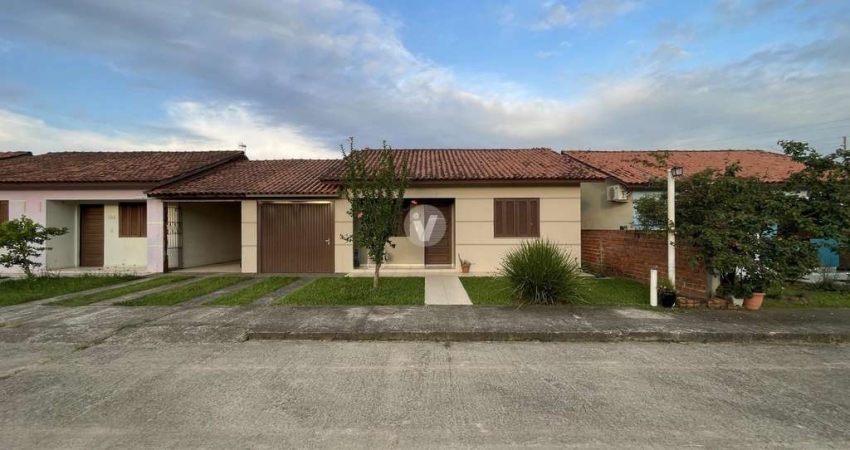 Casa 2 dormitórios em condomínio fechado no bairro Jardim Berleze