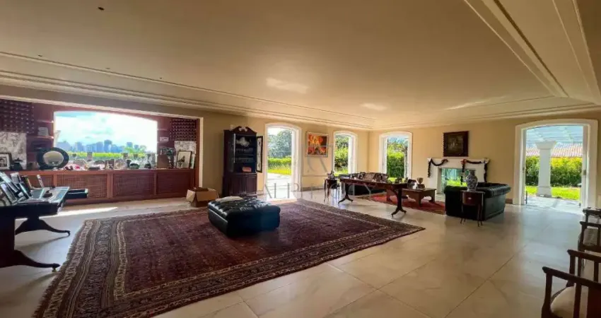 Residência elegante em frente à maior praça do condomínio, 4 suítes e 18 vagas de garagem!