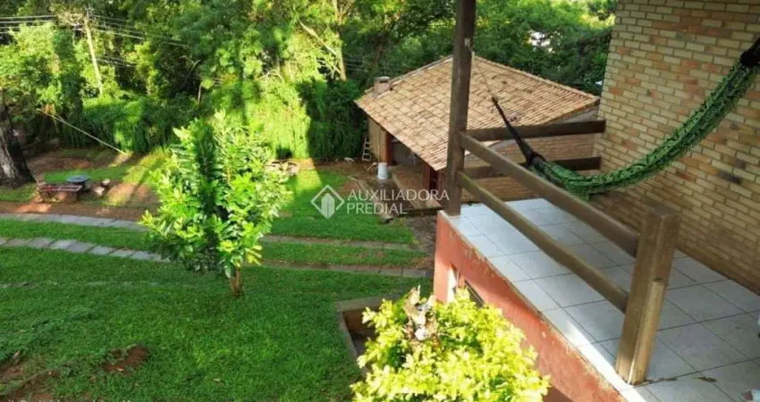 Casa com 4 quartos à venda na Rua Pedro de Oliveira França, 80, Hípica, Porto Alegre