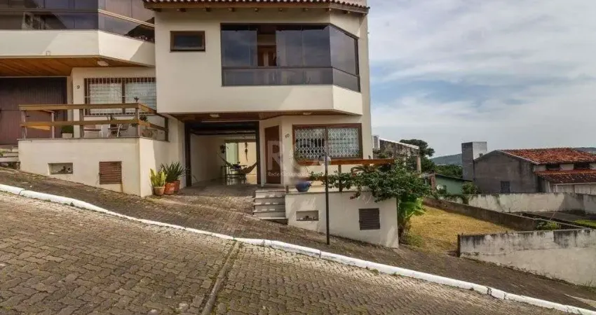 Casa em condomínio fechado com 3 quartos à venda na Rua Alcebíades Antônio dos Santos, 635, Nonoai, Porto Alegre