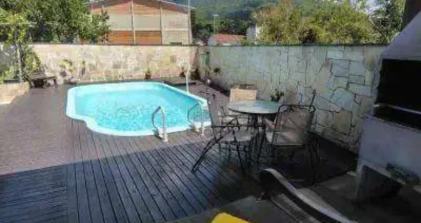 Casa com 3 dormitórios à venda, 360 m² por R$ 900.000,00 - Enseada de Brito - Palhoça/SC
