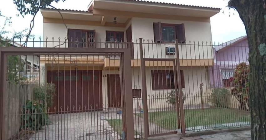 Casa com 3 quartos à venda na Avenida Cruz Alta, 499, Nonoai, Porto Alegre