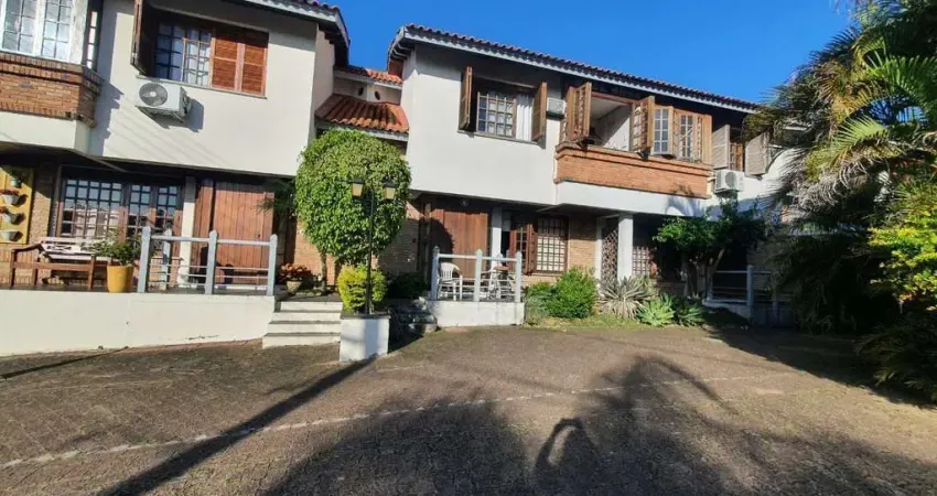 Casa em condomínio fechado com 3 quartos à venda na Avenida da Cavalhada, 6021, Cavalhada, Porto Alegre