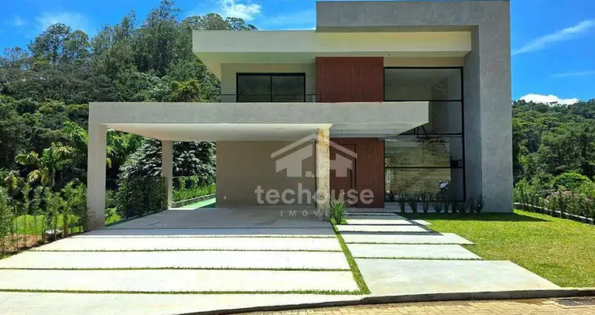Casa Contemporânea, em Condomínio, no bairro de Quebra-Frascos - Teresópolis: 405m² de Área Construída e Vista para o Lago, 4 suítes e Lazer Completo.