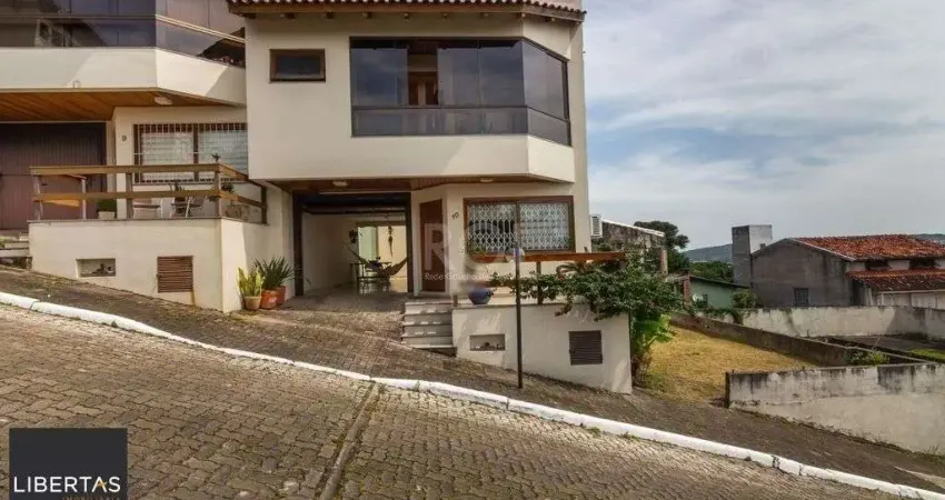 Casa em condomínio fechado com 3 quartos à venda na Rua Alcebíades Antônio dos Santos, 635, Nonoai, Porto Alegre