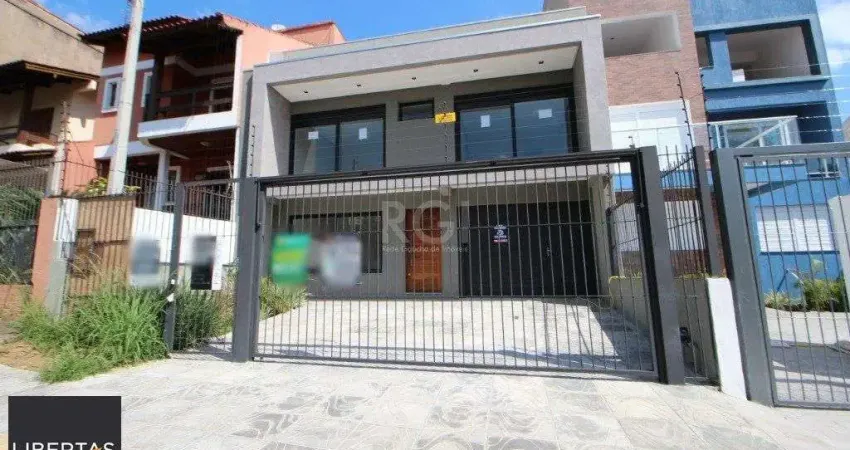 Casa com 3 quartos à venda na Rua Buarque de Macedo, 931, São Geraldo, Porto Alegre