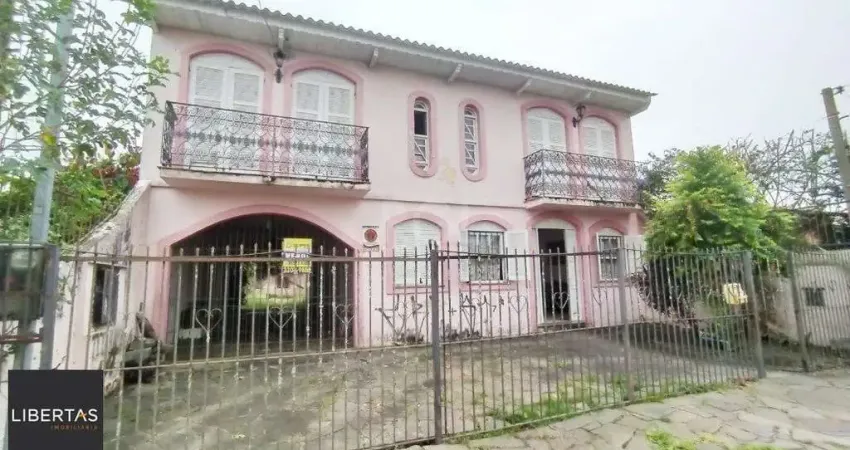 Casa com 3 quartos à venda na Rua Jacipuia, 332, Guarujá, Porto Alegre