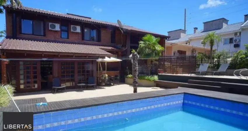 Casa residencial mobiliada, com churrasqueira, hidromassagem e piscina
