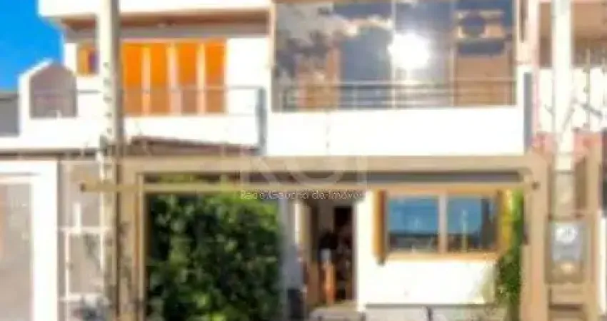 Casa com 3 quartos à venda na Rua Waldemar da Silva Tavares, 234, Guarujá, Porto Alegre