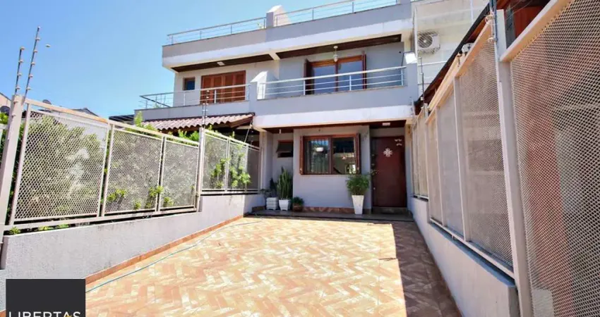 Casa com 3 quartos à venda na Rua Heitor Kramer, 294, Guarujá, Porto Alegre