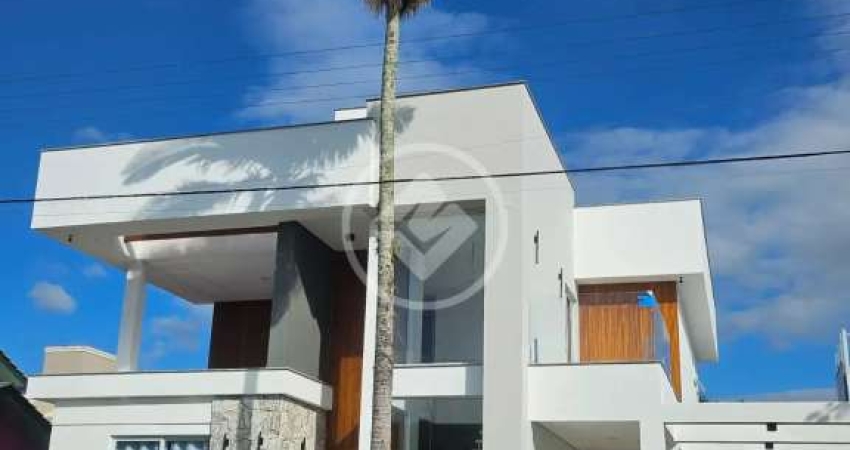 Casa frente ao mar na Praia da Daniela. Com 5 dormitorios, 6 banheiros, 3 vagas de garagem, piscina e muito mais! codigo: 129672