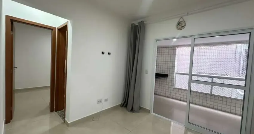 Apartamento com 1 dormitório para alugar, 50 m² por R$ 2.302,00 - Vilamar - Praia Grande/SP