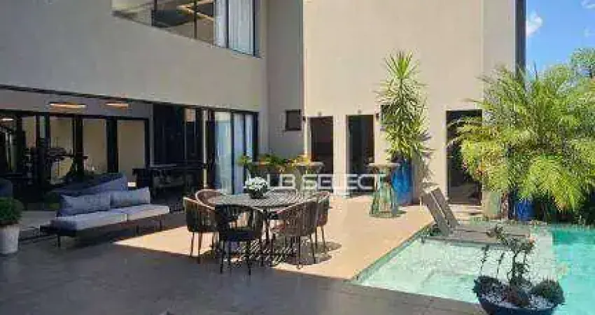 Mansão no Condomínio Jardins Gênova com quatro suítes e área gourmet completa.