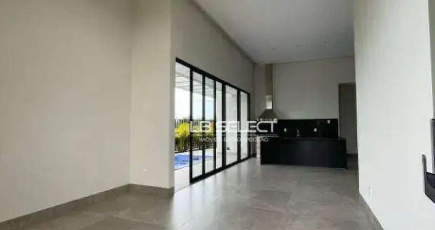 Casa em condomínio fechado com quatro suítes, sala em dois ambientes, piscina e garagem para três carros.
