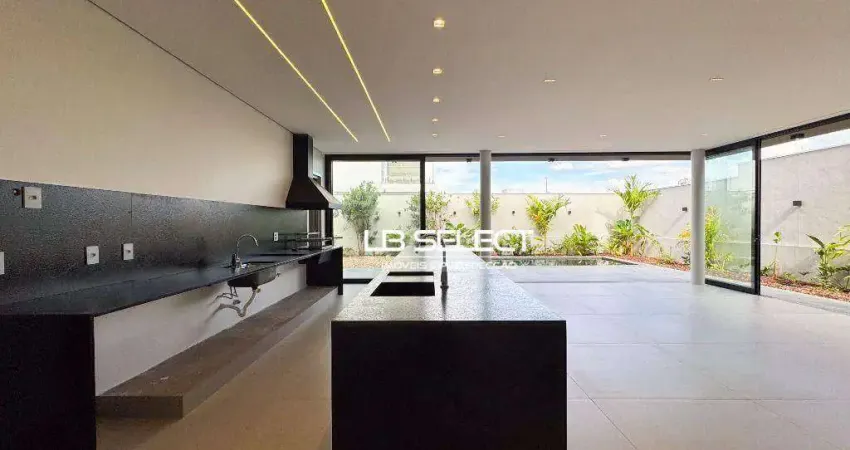 Casa no Condomínio Alphaville II com quatro suítes e varanda gourmet completa.