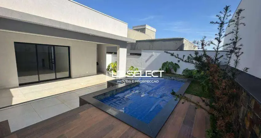 Casa no Condomínio Alphaviille I com três suítes e varanda gourmet.