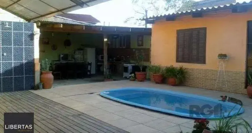 Casa com 4 quartos à venda na Rua Paulo Rubilar de Farias, 190, Restinga, Porto Alegre