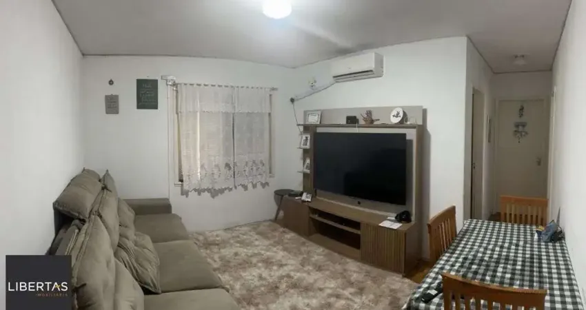 Apartamento de 2 dormitórios, living, cozinha, área de serviço e banheiro social.