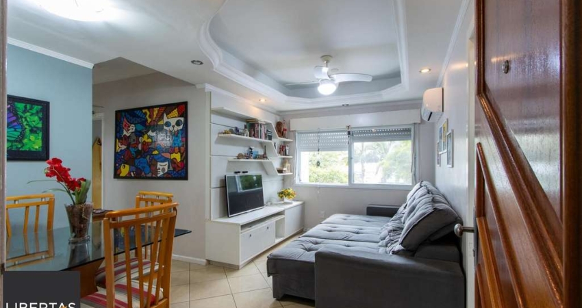 Apartamento de 2 quartos, living, cozinha planejada, área de serviço e 1 vaga.