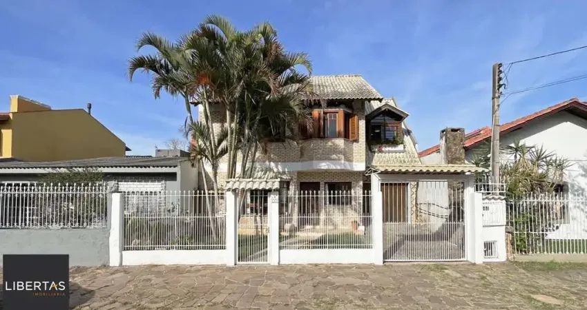 Casa com 4 quartos à venda na Avenida Guarujá, 115, Guarujá, Porto Alegre